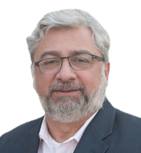 Portrait of a professional man with glasses and a beard, representing leadership in healthcare and investment sectors, relevant to KVLR Capital's team and partnership criteria.